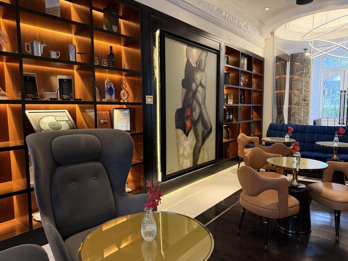 Guest lounge with display shelving, artwork and seating
