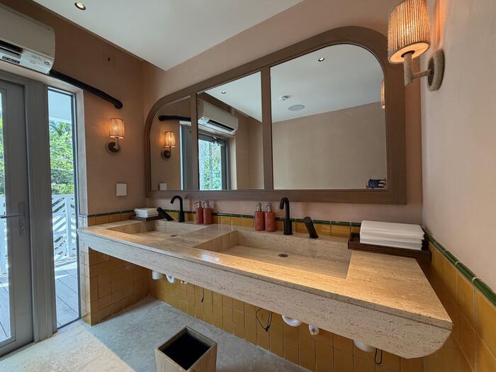 Guest bathroom double vanity with tiled surround